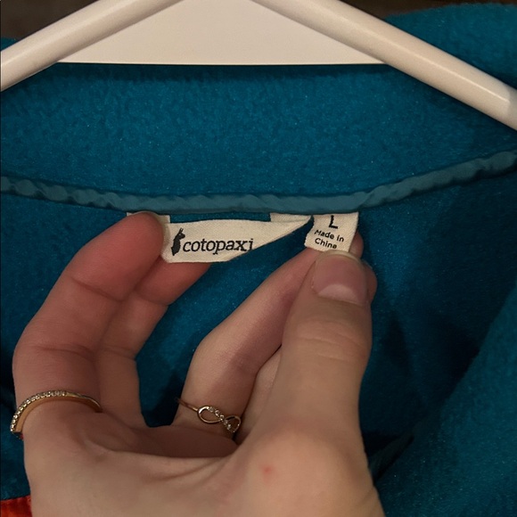 Cotopaxi Teal Pullover with Orange and Purple Accents - Picture 2 of 3